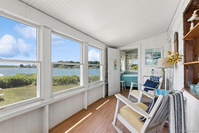Tucked away in a secluded waterfront setting, this charming - photo 17