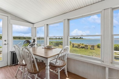 Tucked away in a secluded waterfront setting, this charming - photo 18
