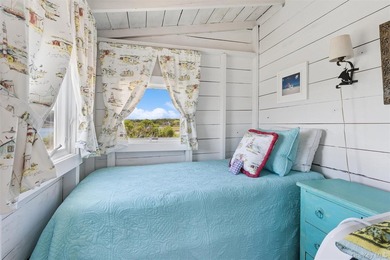 Tucked away in a secluded waterfront setting, this charming - photo 19