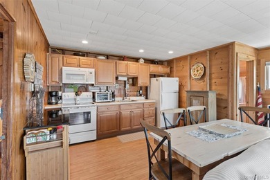Tucked away in a secluded waterfront setting, this charming - photo 20