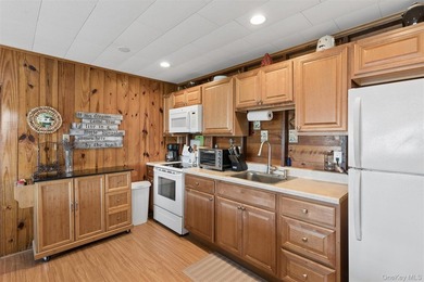 Tucked away in a secluded waterfront setting, this charming - photo 21