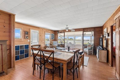 Tucked away in a secluded waterfront setting, this charming - photo 22