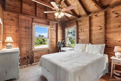 Tucked away in a secluded waterfront setting, this charming - photo 23