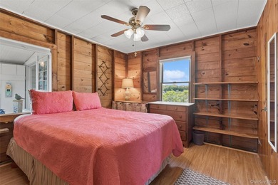 Tucked away in a secluded waterfront setting, this charming - photo 24