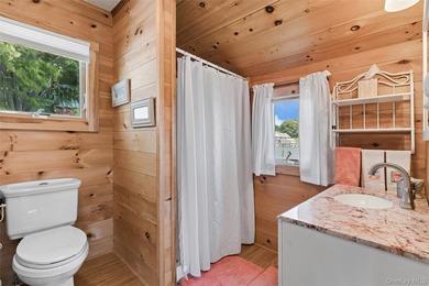 Tucked away in a secluded waterfront setting, this charming - photo 25