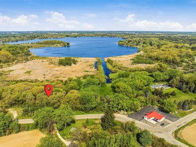 Perched atop a scenic knoll, this beautiful 1.5-acre wooded - photo 8