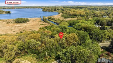 Perched atop a scenic knoll, this beautiful 1.5-acre wooded - photo 9