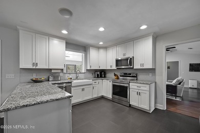**UPDATED**FENCED BACKYARD**NEW ROOF** Welcome to this stunning - photo 3