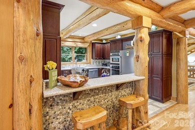 Stunning custom log home nestled on over 3 acres in the shadow - photo 13