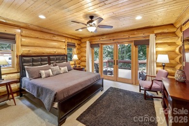Stunning custom log home nestled on over 3 acres in the shadow - photo 17