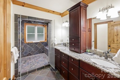 Stunning custom log home nestled on over 3 acres in the shadow - photo 18