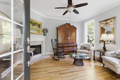 Nestled under mature oak trees and surrounded by gardens, you'll - photo 12