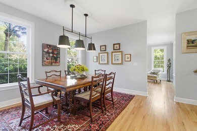 Nestled under mature oak trees and surrounded by gardens, you'll - photo 15