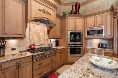 Expansive, gated, waterfront family estate meets effortless - photo 15