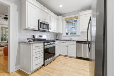 Nestled under mature oak trees and surrounded by gardens, you'll - photo 18