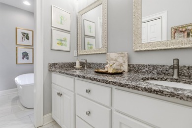 Nestled under mature oak trees and surrounded by gardens, you'll - photo 31