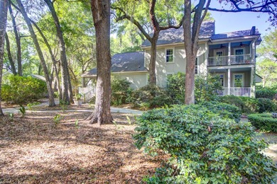Nestled under mature oak trees and surrounded by gardens, you'll - photo 47