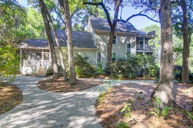 Nestled under mature oak trees and surrounded by gardens, you'll - photo 48