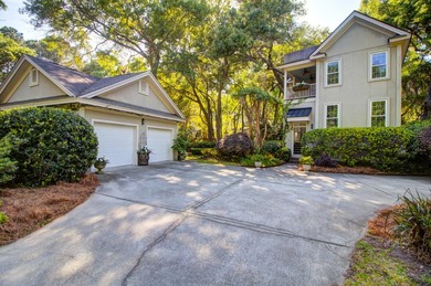 Nestled under mature oak trees and surrounded by gardens, you'll - photo 49