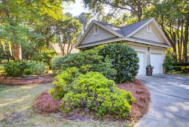 Nestled under mature oak trees and surrounded by gardens, you'll - photo 50