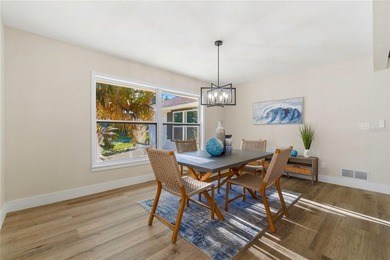 Inside, the home has been thoughtfully updated with an open - photo 3