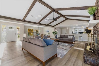 Inside, the home has been thoughtfully updated with an open - photo 4