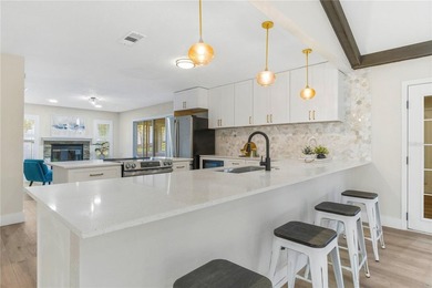 Inside, the home has been thoughtfully updated with an open - photo 5