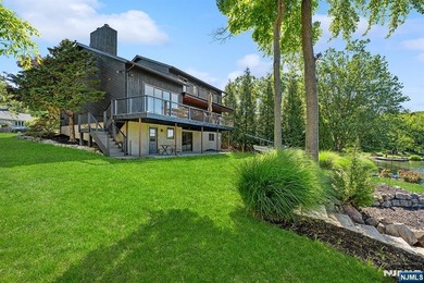 Experience the ultimate lakefront lifestyle in this exceptional - photo 1