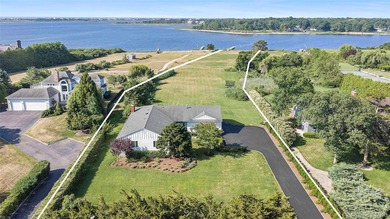 Nestled along the waterfront in East Quogue, 50 Sunset Avenue - photo 1