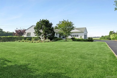 Nestled along the waterfront in East Quogue, 50 Sunset Avenue - photo 2