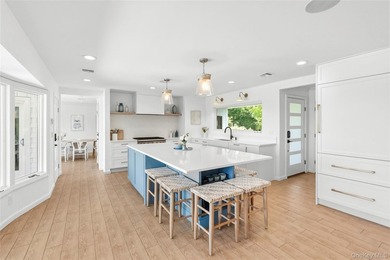 Nestled along the waterfront in East Quogue, 50 Sunset Avenue - photo 3