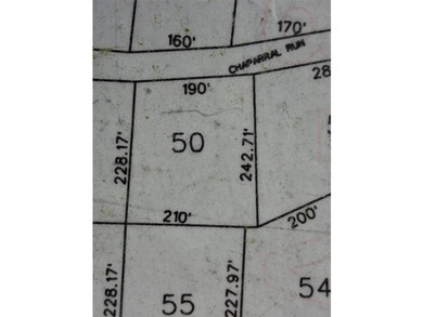 Large 1.06 acre heavily wooded lot located in the gated - photo 2