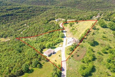 Panoramic views overlooking the Ozark Hills surround this - photo 3
