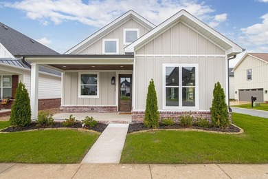 Welcome to 312 Gardens Lane, your dream home nestled in the - photo 1