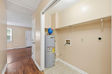This three-bedroom, one-and-a-half-bath home is situated on a - photo 22