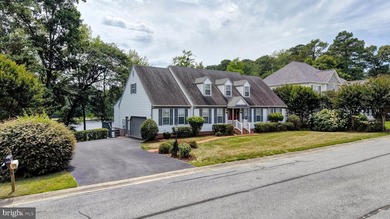 Nestled along scenic Schumaker Pond, this spacious Cape Cod - photo 2