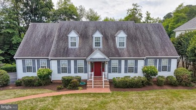 Nestled along scenic Schumaker Pond, this spacious Cape Cod - photo 3