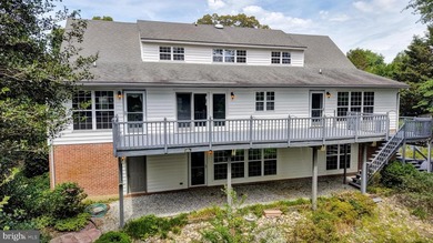 Nestled along scenic Schumaker Pond, this spacious Cape Cod - photo 4