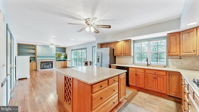 Nestled along scenic Schumaker Pond, this spacious Cape Cod - photo 8