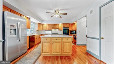 Nestled along scenic Schumaker Pond, this spacious Cape Cod - photo 10