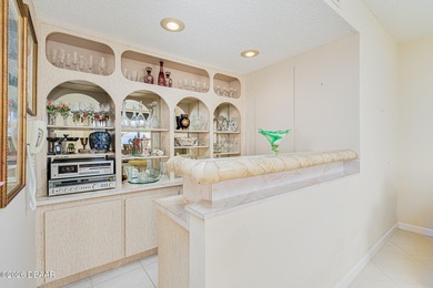 Perched high above the shoreline, this exceptional 12th-floor