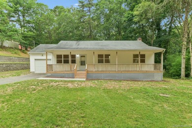 Tucked away on just over an acre in a private, wooded setting - photo 1