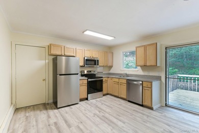 Tucked away on just over an acre in a private, wooded setting - photo 8