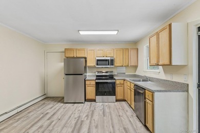 Tucked away on just over an acre in a private, wooded setting - photo 9