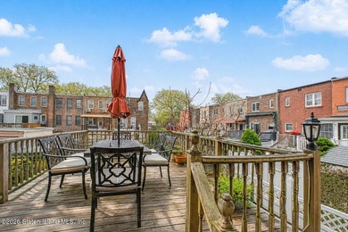 Located at 1879 Haring Street, this full brick end-unit - photo 13