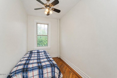 Located at 1879 Haring Street, this full brick end-unit - photo 15