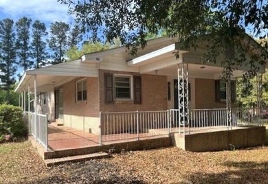 This well maintained 4 BR, 2 BA home is located just inside the - photo 1