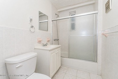 Located at 1879 Haring Street, this full brick end-unit - photo 22