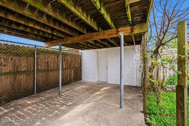 Located at 1879 Haring Street, this full brick end-unit - photo 24