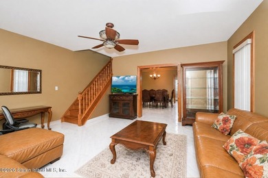 Located at 1879 Haring Street, this full brick end-unit - photo 26
